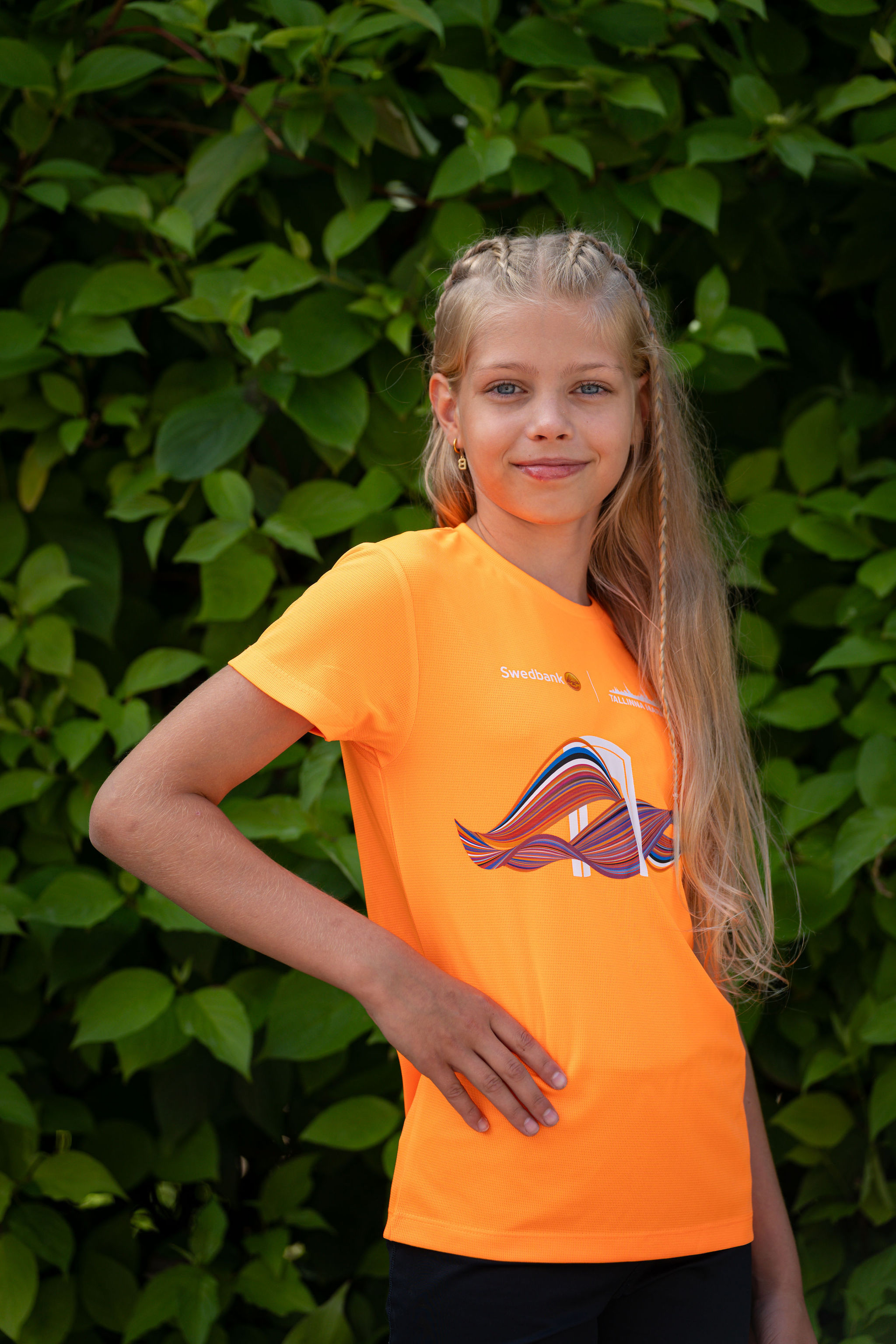 A child wearing the official Tallinn Marathon 2026 T-shirt
